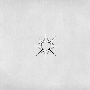 Sun tattoo with dotted pattern