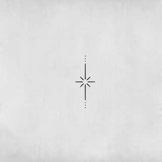 Minimalist twinkling star tattoo