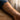 Fine line poppy temporary tattoo worn on the outer forearm, 1.1 x 4.2 in – InkToday